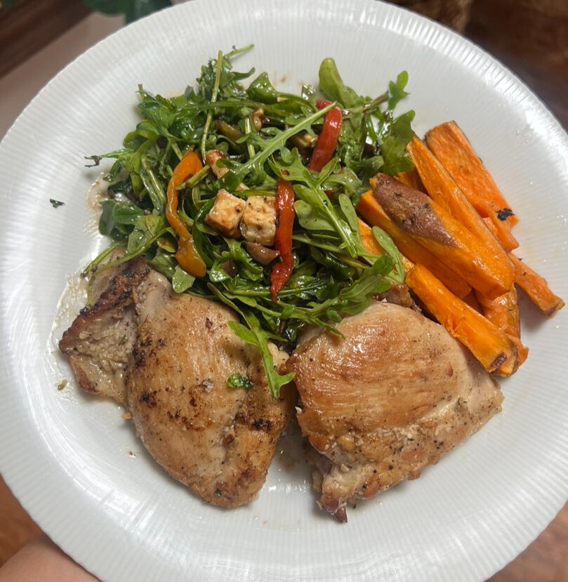 Organic Chicken Thighs with Arugula Salad with roasted peppers, chopped olives, and blue cheese, with V-Berry Vinaigrette with Sweet Potato Fries